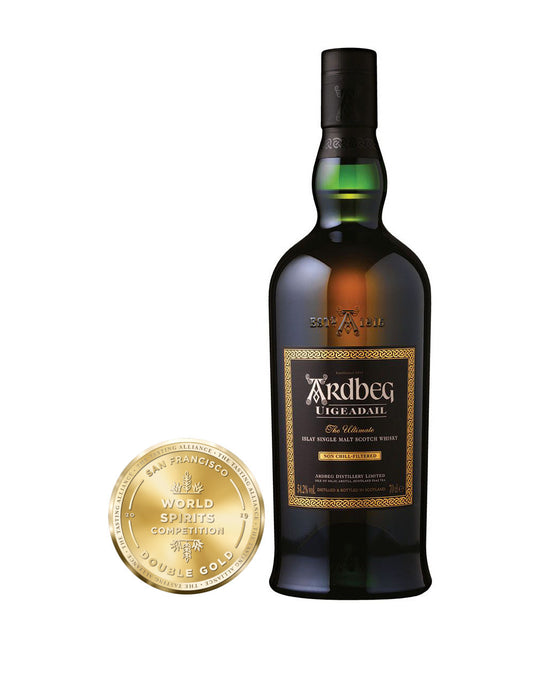 Ardbeg Uigeadail Single Malt Scotch Whisky bottle and awards