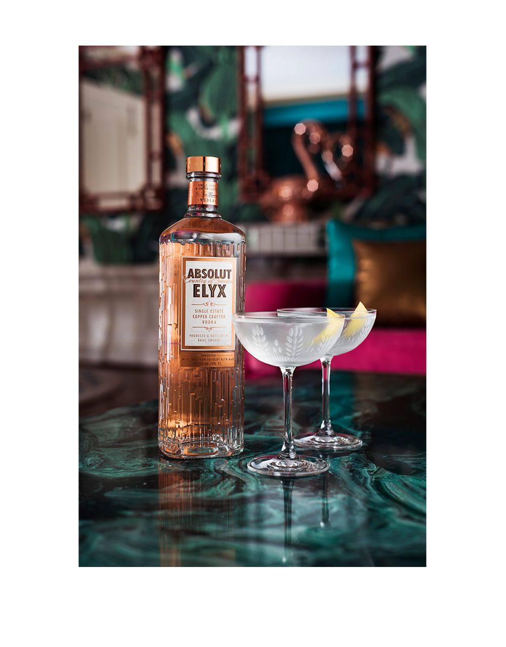 Absolut Elyx Single Estate Handcrafted Vodka on a bar with cocktails